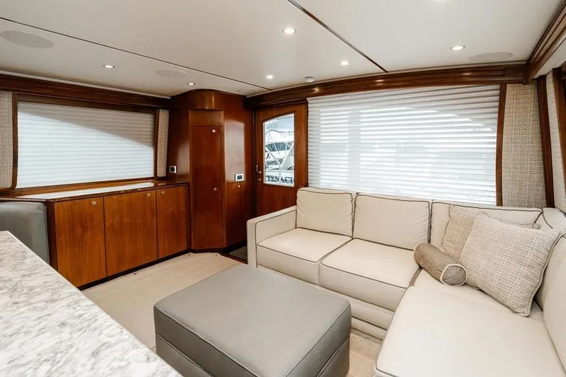 Trailer Trash Yacht Photos Pics Luxurious interior of 2021 Viking 58 Convertible yacht with elegant seating and wood finishes.