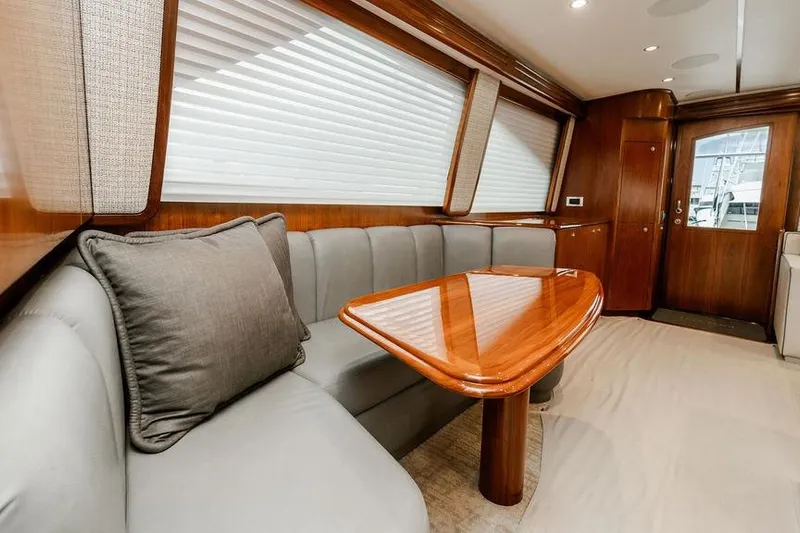Trailer Trash Yacht Photos Pics Luxurious interior of 2021 Viking 58 Convertible yacht with elegant wood finishes.
