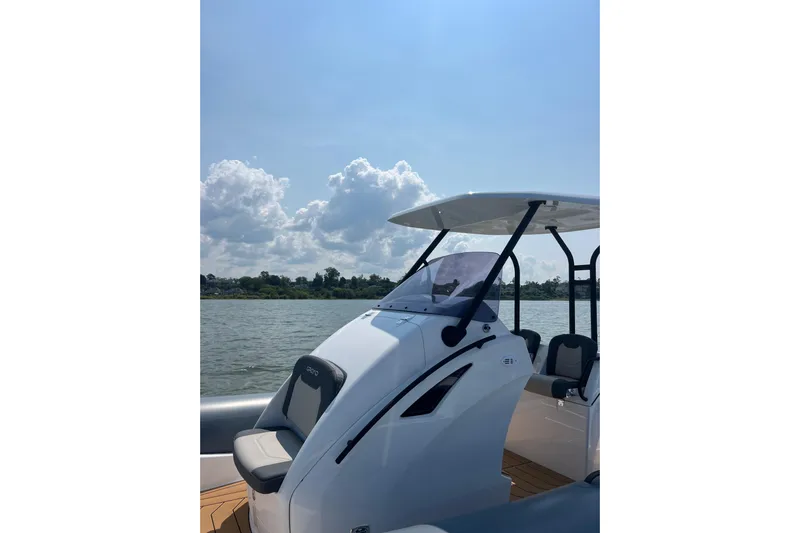  Yacht Photos Pics 2025 Grand Inflatables G850 boat on water under clear sky.