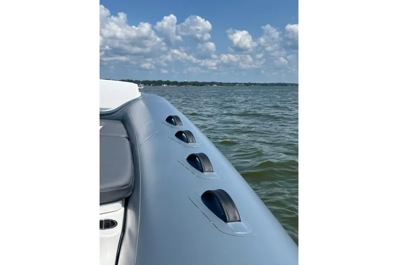  Yacht Photos Pics 2025 Grand Inflatables G850 boat on water under blue sky.