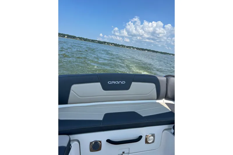  Yacht Photos Pics 2025 Grand Inflatables G850 boat on a lake with clear skies.