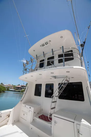 Andiamo Yacht Photos Pics 2005 Vicem 54 Sportfish yacht with upper deck and fishing equipment.