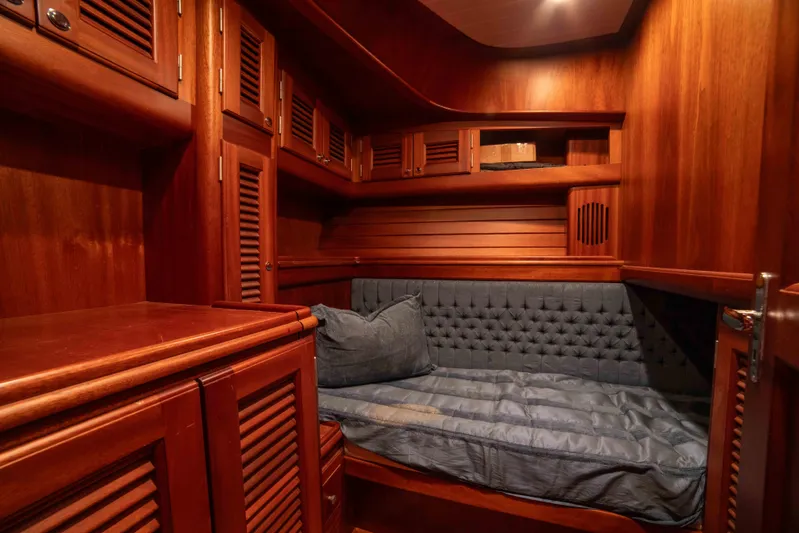 Andiamo Yacht Photos Pics Luxurious wooden cabin interior of 2005 Vicem 54 Sportfish yacht with cozy bed.