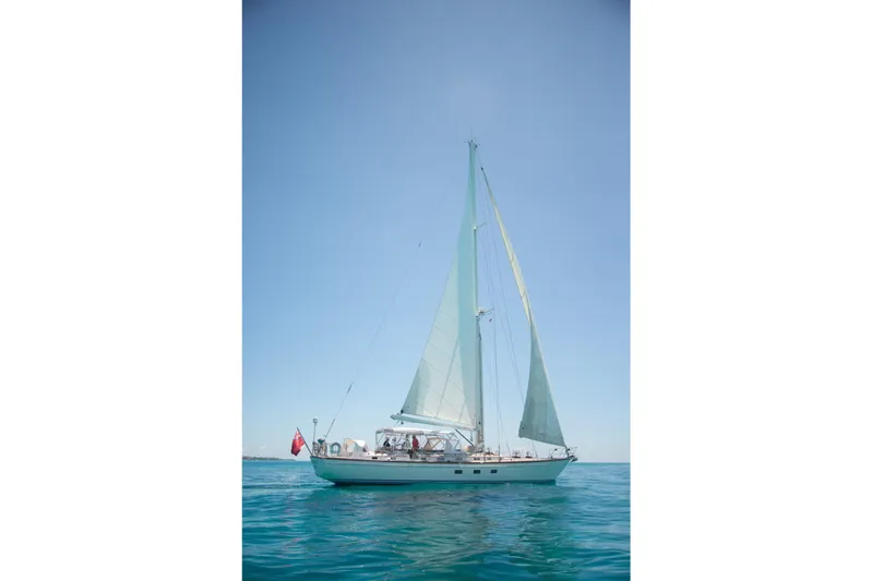 Tuatara Yacht Photos Pics Sailing yacht Little Harbor 63, 1983 model, on calm blue waters under clear sky.