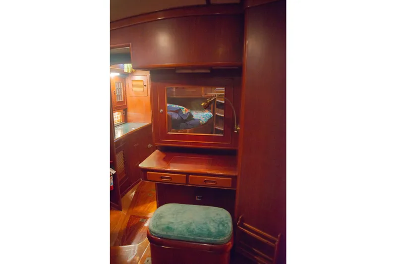 Tuatara Yacht Photos Pics Interior of 1983 Little Harbor 63 yacht with wooden cabinetry and mirror.