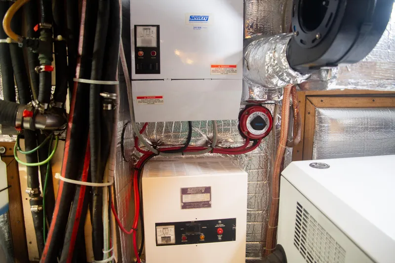 Tuatara Yacht Photos Pics Engine room of 1983 Little Harbor 63 yacht with electrical equipment and wiring.