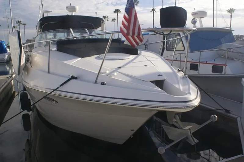 Grand Cru Yacht Photos Pics 2005 Cruisers Yachts 340 Express docked, featuring sleek design and American flag.