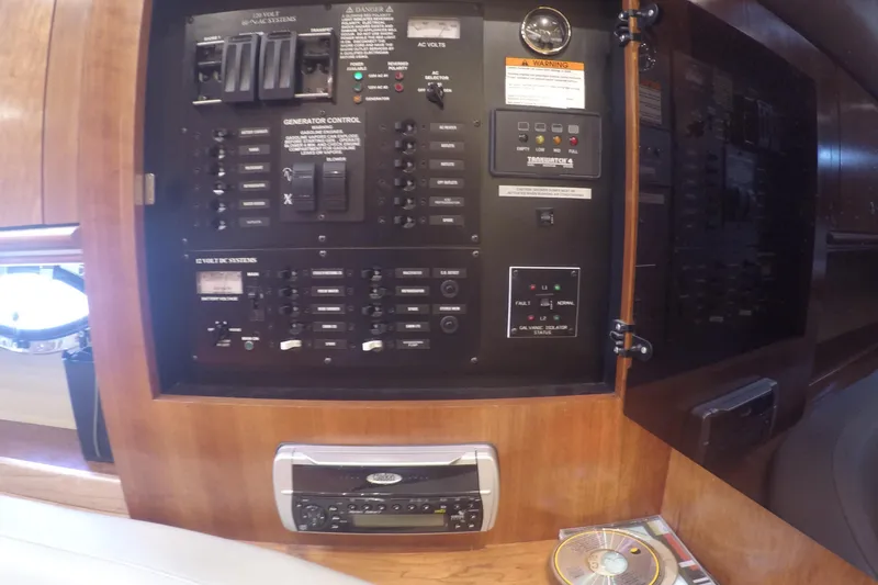 Grand Cru Yacht Photos Pics Electrical control panel inside 2005 Cruisers Yachts 340 Express, featuring switches and a stereo system.