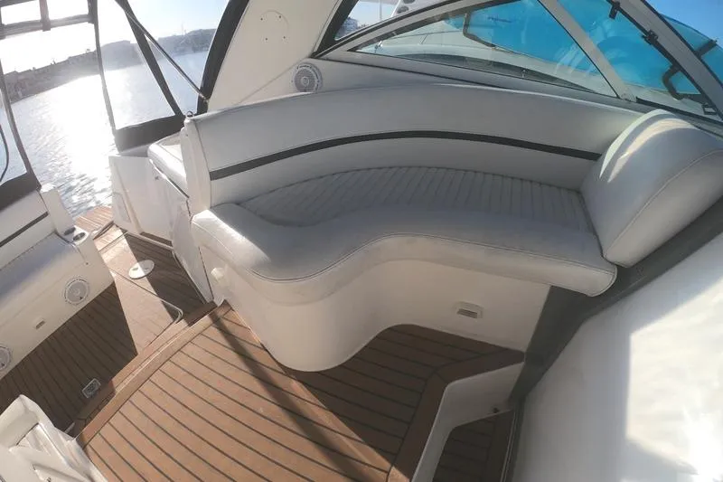 Grand Cru Yacht Photos Pics 2005 Cruisers Yachts 340 Express interior with white seating and wooden flooring.