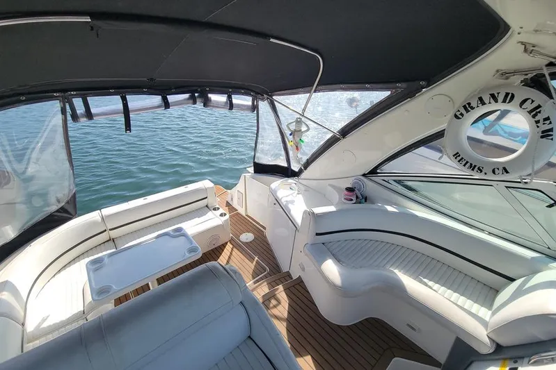 Grand Cru Yacht Photos Pics 2005 Cruisers Yachts 340 Express interior with seating, table, and water view.