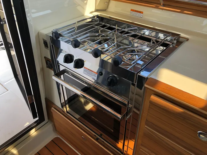  Yacht Photos Pics Stainless steel stove and oven in 2022 Ranger Tugs R-27 boat kitchen.