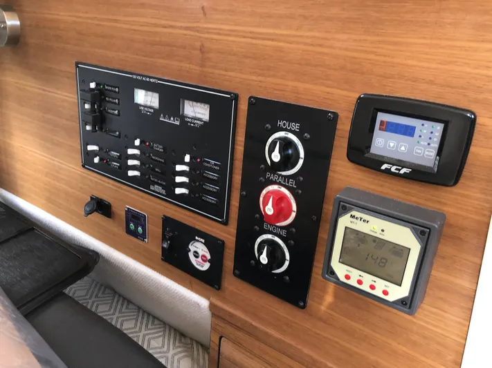  Yacht Photos Pics Control panel of 2022 Ranger Tugs R-27 boat with various switches and displays.