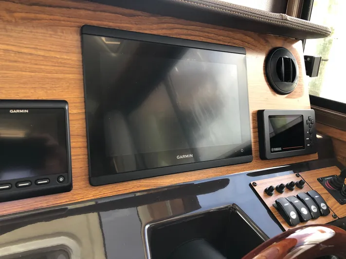  Yacht Photos Pics Dashboard of 2022 Ranger Tugs R-27 with Garmin navigation displays and controls.