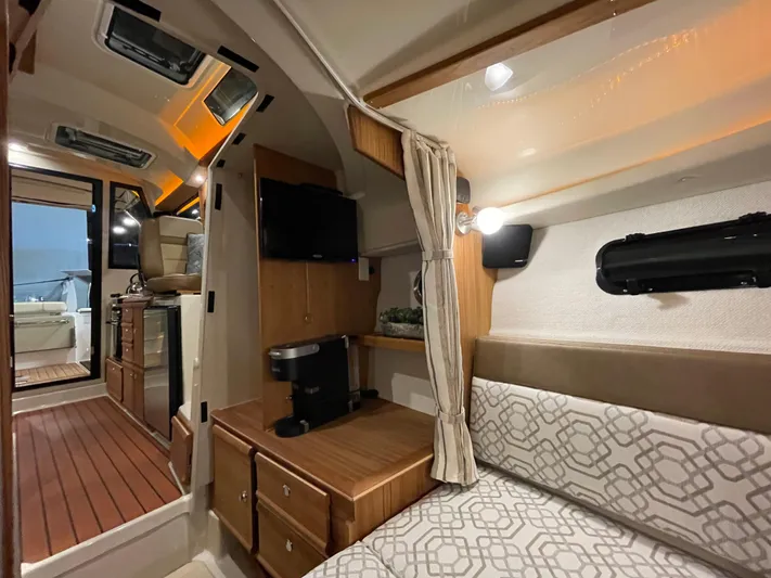  Yacht Photos Pics 2022 Ranger Tugs R-27 interior with cozy seating, wood accents, and modern amenities.