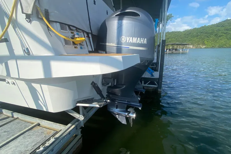  Yacht Photos Pics 2024 Jeanneau NC 895 with Yamaha outboard motor docked on a sunny day.
