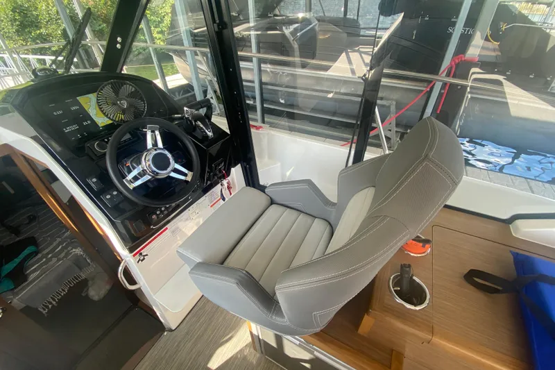  Yacht Photos Pics 2024 Jeanneau NC 895 helm station with modern steering and comfortable seating.