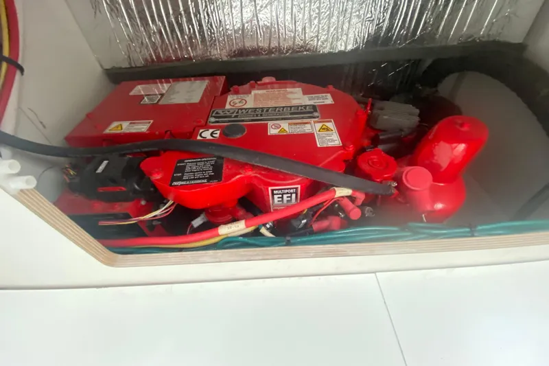  Yacht Photos Pics Engine compartment of 2024 Jeanneau NC 895 with red Westerbeke generator.