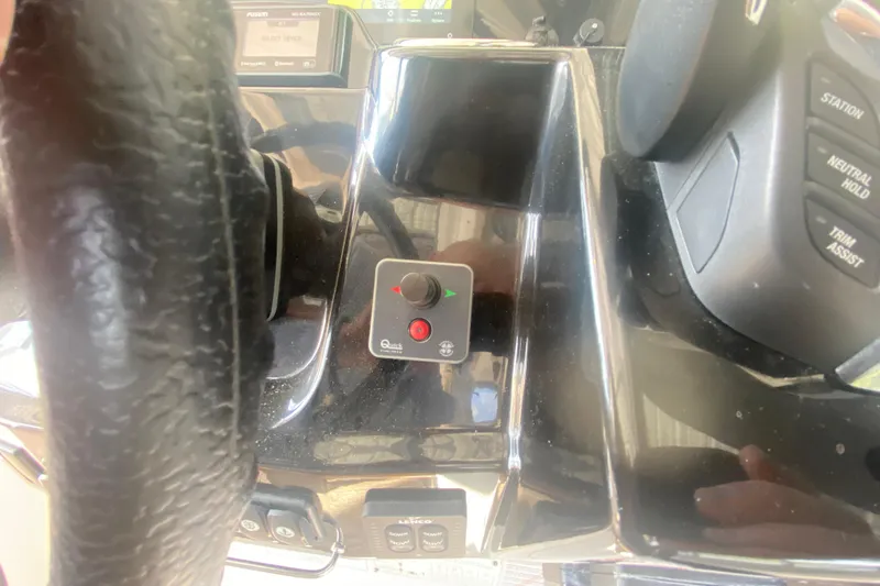  Yacht Photos Pics 2024 Jeanneau NC 895 helm controls with steering wheel and electronic panel.