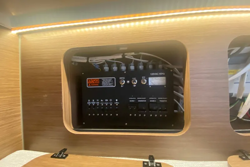  Yacht Photos Pics Electrical panel inside 2024 Jeanneau NC 895 boat, featuring switches and wiring.