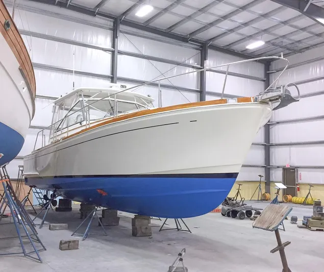 Salty Witch Yacht Photos Pics 1998 Grand Banks 38 Eastbay EX yacht in a storage facility, elevated on supports.