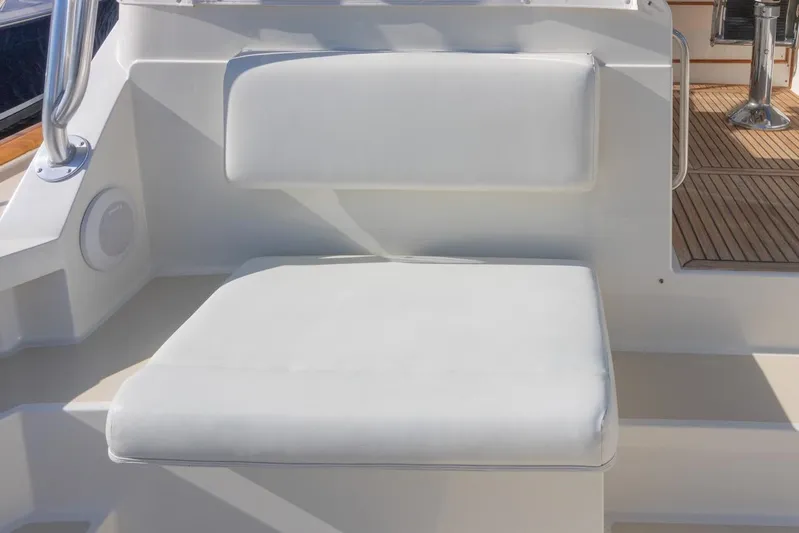 Salty Witch Yacht Photos Pics White cushioned seat on 1998 Grand Banks 38 Eastbay EX yacht deck.