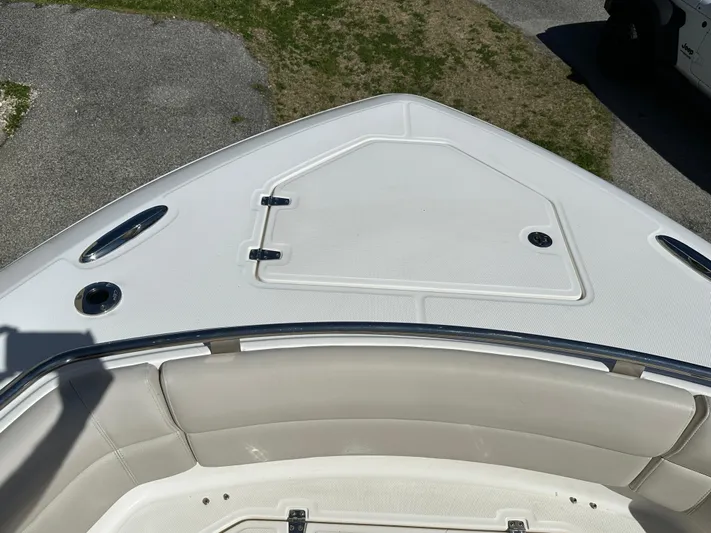 Dream Chaser Yacht Photos Pics 2021 Boston Whaler Realm 380 boat deck, featuring sleek design and spacious seating.