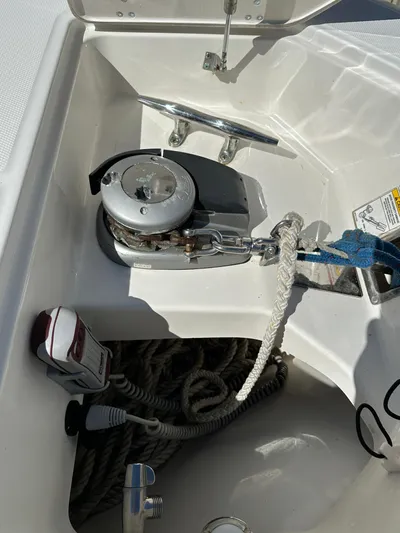 Dream Chaser Yacht Photos Pics 2021 Boston Whaler Realm 380 anchor compartment with winch and rope storage.