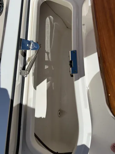 Dream Chaser Yacht Photos Pics Open storage compartment on a 2021 Boston Whaler Realm 380 boat.