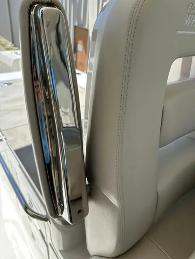 Dream Chaser Yacht Photos Pics Close-up of 2021 Boston Whaler Realm 380 seat with chrome detailing.