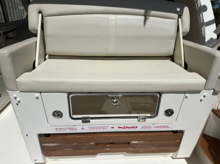 Dream Chaser Yacht Photos Pics 2021 Boston Whaler Realm 380 boat seat with storage compartment.