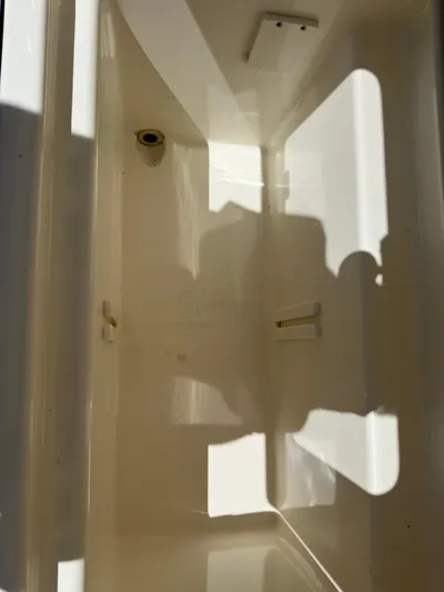 Dream Chaser Yacht Photos Pics 2021 Boston Whaler Realm 380 interior compartment, showcasing clean, spacious design.