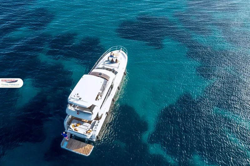 Sea Change Yacht Photos Pics Aerial view of 2021 Prestige 590 Fly yacht on clear blue water.