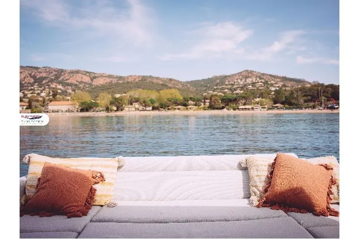 Sea Change Yacht Photos Pics Luxurious Prestige 590 Fly yacht with scenic coastal view, 2021 model.