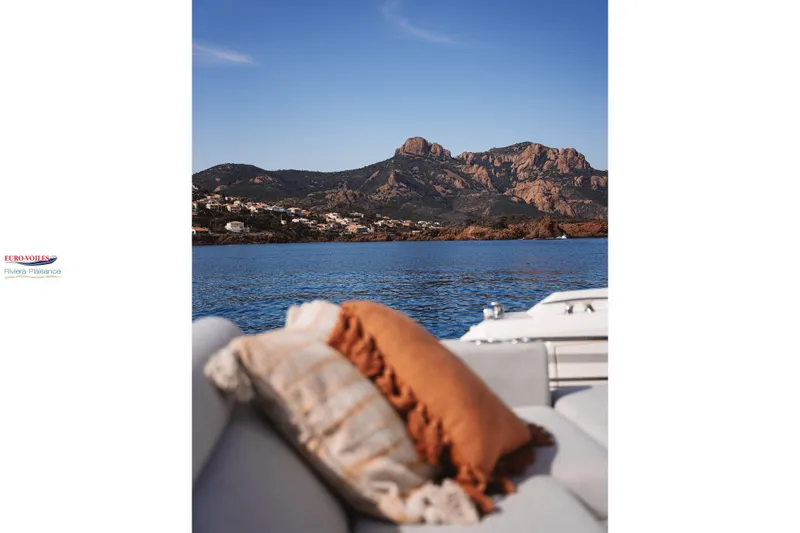 Sea Change Yacht Photos Pics Luxurious Prestige 590 Fly yacht with scenic coastal mountain view, 2021 model.