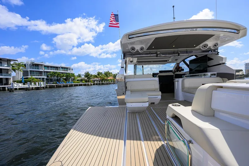 2024 Cruisers Yachts 50 Gls Outboard Yacht Photos Pics 2024 Cruisers Yachts GLS-OB on water, showcasing luxury deck and seating.