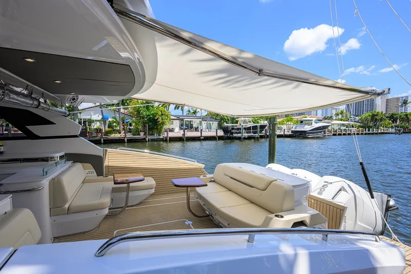 2024 Cruisers Yachts 50 Gls Outboard Yacht Photos Pics 2024 Cruisers Yachts GLS-OB luxury deck with seating, canopy, and waterfront view.