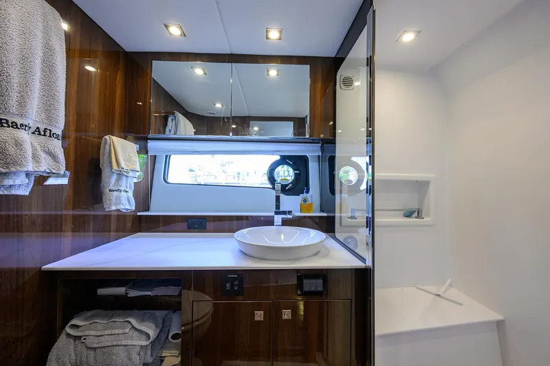 2024 Cruisers Yachts 50 Gls Outboard Yacht Photos Pics Luxurious 2024 Cruisers Yachts GLS-OB bathroom with modern fixtures and elegant wood finishes.