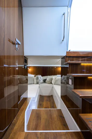 2024 Cruisers Yachts 50 Gls Outboard Yacht Photos Pics 2024 Cruisers Yachts GLS-OB interior with modern wood finish and cozy seating area.