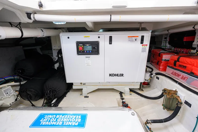 2024 Cruisers Yachts 50 Gls Outboard Yacht Photos Pics 2024 Cruisers Yachts GLS-OB engine room with Kohler generator and safety equipment.