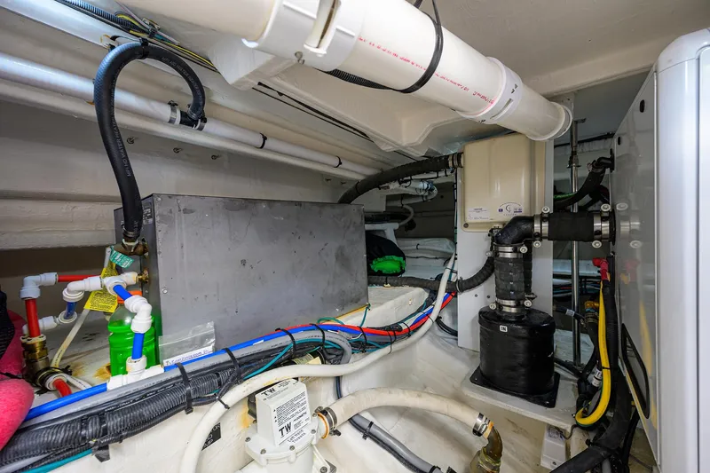 2024 Cruisers Yachts 50 Gls Outboard Yacht Photos Pics 2024 Cruisers Yachts GLS-OB engine room with pipes, wiring, and mechanical components.