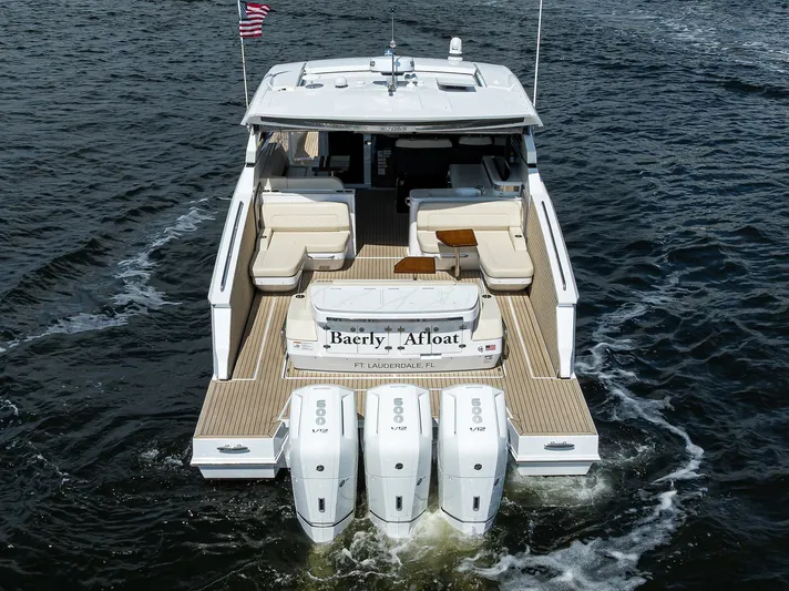 2024 Cruisers Yachts 50 Gls Outboard Yacht Photos Pics 2024 Cruisers Yachts GLS-OB on water, rear view with triple outboard engines.