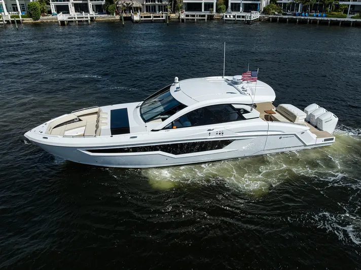 2024 Cruisers Yachts 50 Gls Outboard Yacht Photos Pics 2024 Cruisers Yachts GLS-OB luxury boat cruising on a river.