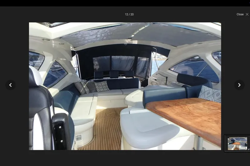  Yacht Photos Pics Interior of 2006 Azimut Atlantis 55 yacht with elegant seating and wooden table.