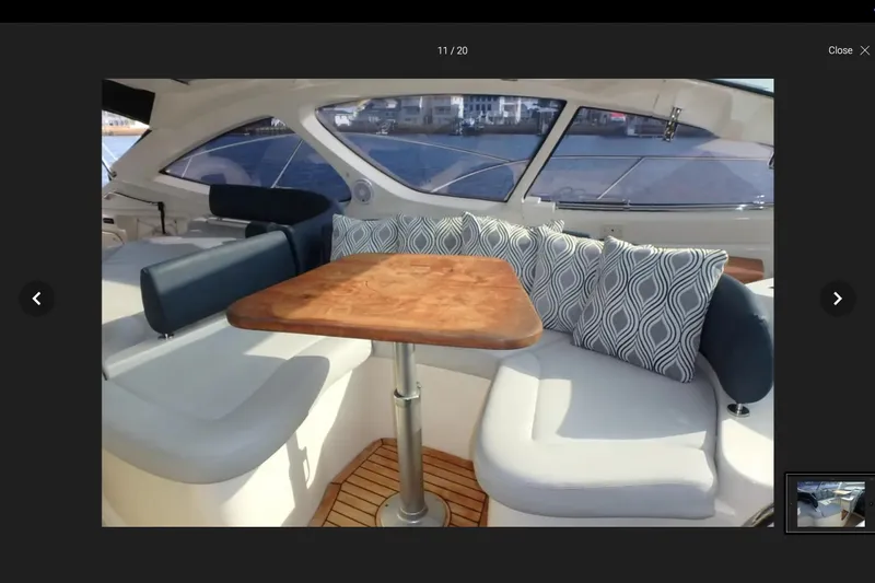  Yacht Photos Pics Interior of 2006 Azimut Atlantis 55 yacht with elegant seating and wooden table.