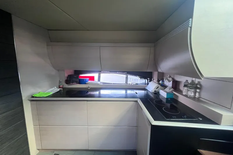  Yacht Photos Pics Modern kitchen interior on a 2006 Azimut Atlantis 55 yacht, featuring sleek cabinetry and appliances.