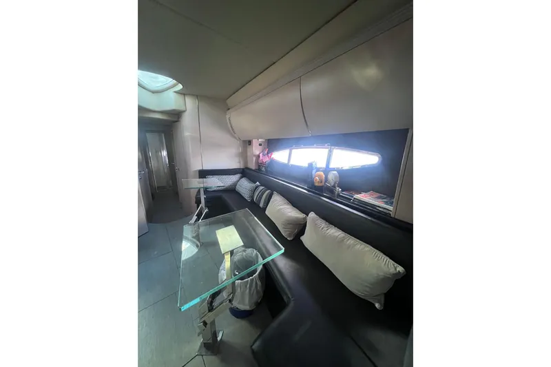  Yacht Photos Pics Interior of 2006 Azimut Atlantis 55 yacht with modern seating and glass table.