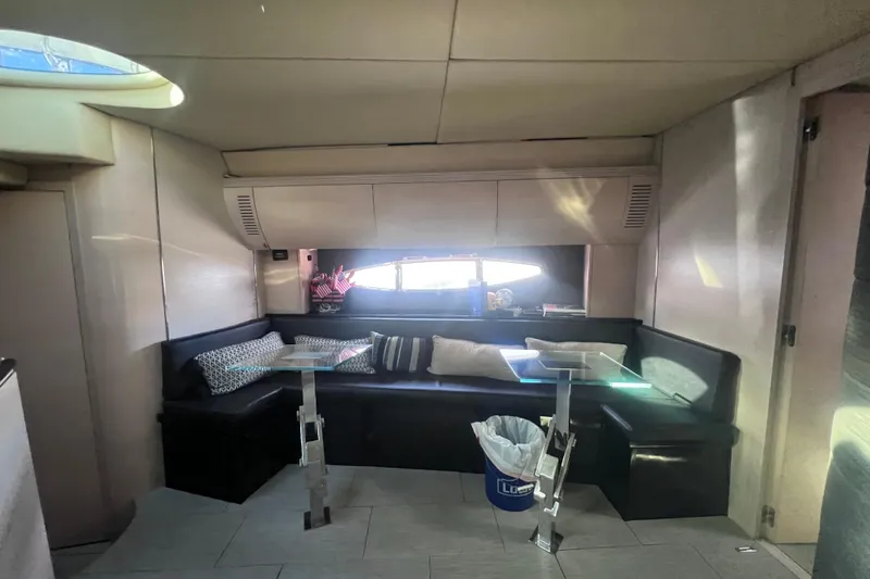  Yacht Photos Pics Interior of 2006 Azimut Atlantis 55 yacht with modern seating and glass tables.