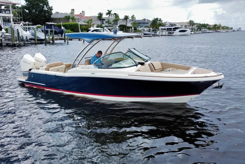  Yacht Photos Pics 2023 Chris-Craft Calypso 28 boat on water, featuring sleek design and dual outboard engines.