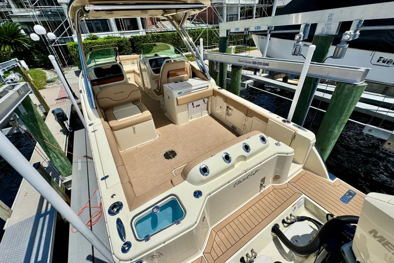  Yacht Photos Pics 2023 Chris-Craft Calypso 28 boat interior, featuring luxurious seating and modern amenities.