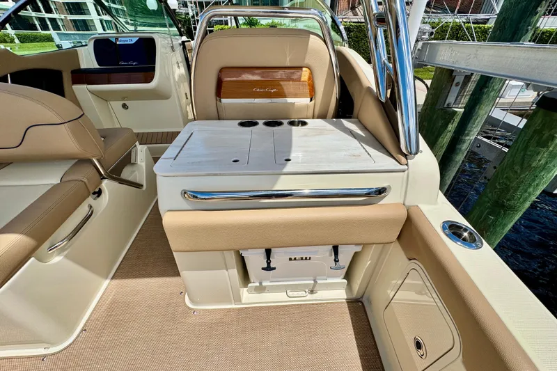  Yacht Photos Pics 2023 Chris-Craft Calypso 28 boat interior with beige seating and sleek design.